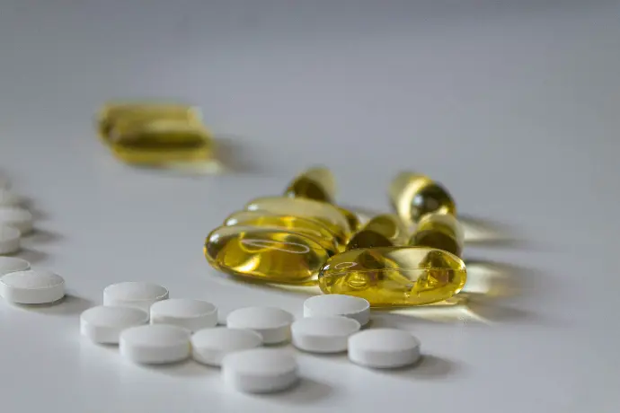 a close up of many pills on a table